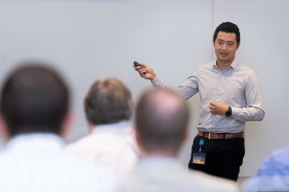 man at a white board