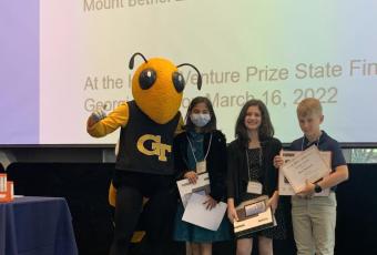 Alexa Duran, Simran Melinamani, and Ben Buzzard of team "Electric City" receive the Energy Award at the K-12 Inventure Prize awards ceremony. They attended the event with their teacher Erica Oakhill.