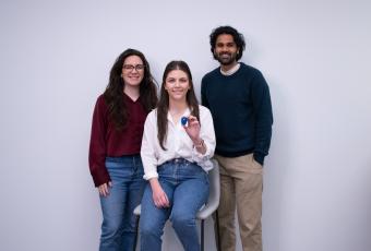 From left to right, Stridelink Founders Cassandra McIltrot , Marzeah “Zea” Khorramabadi, and Neel Narvekar. Khorramabadi is holding one of their sensors, a device like a watch.