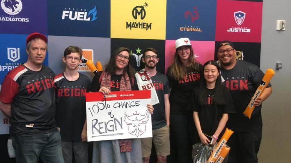 A Georgia Tech VIP class team attending an esports event in Los Angeles in 2019 with Laura Levy (holding the sign).