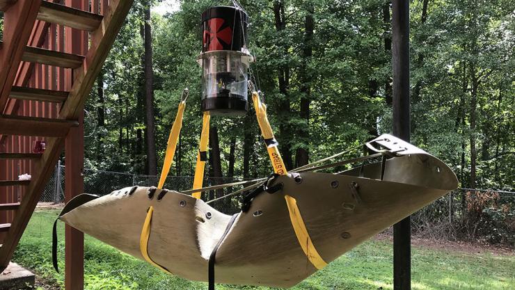 A prototype of the Stabilizing Aerial Loads Utility System, SALUS. The team of Georgia Tech students who invented the device are